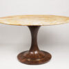 An Oval Pedestal Table by ILIAD Design