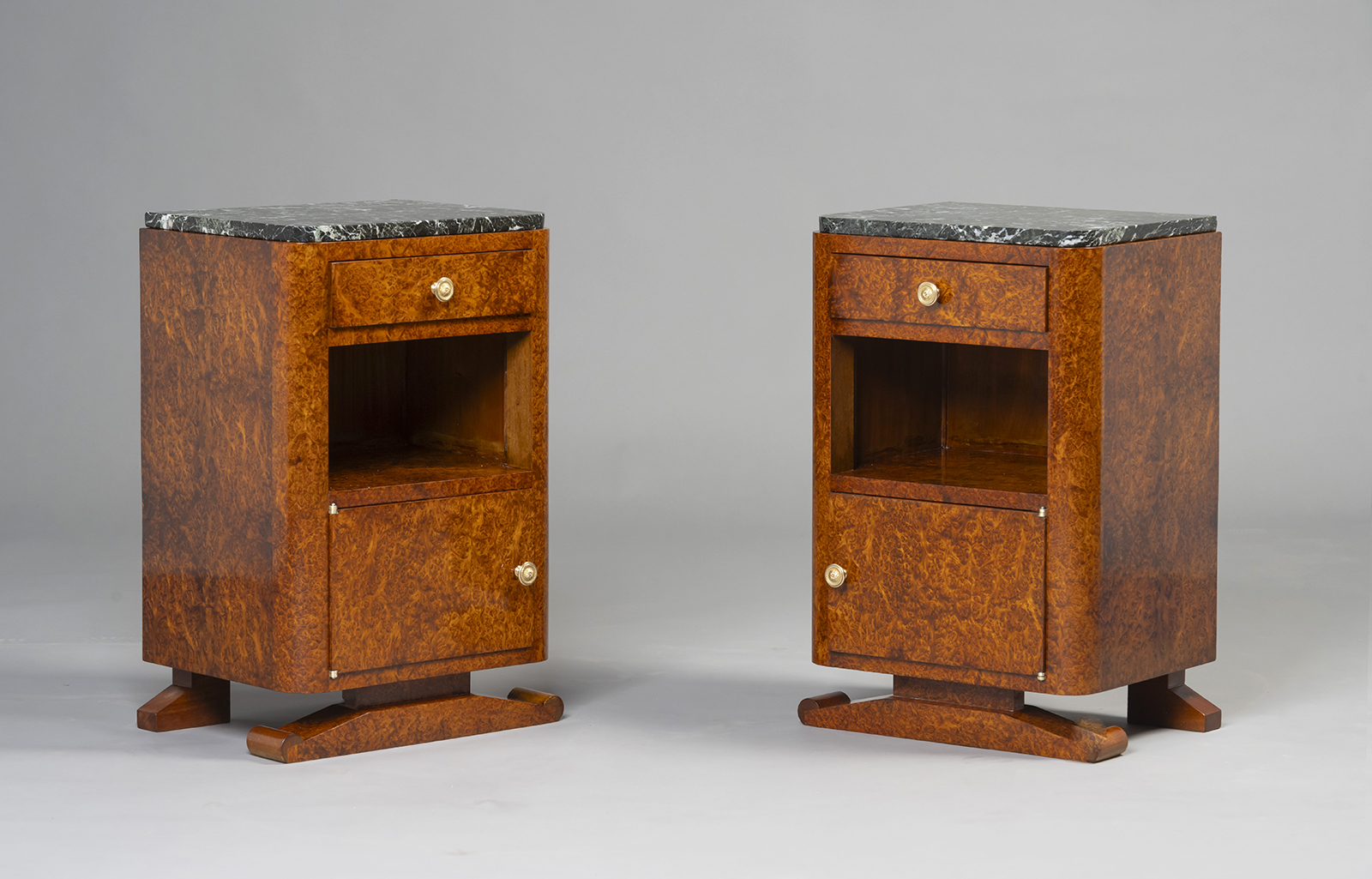 A Matched Pair of Art Deco Nightstands in the manner of Jules Leleu.